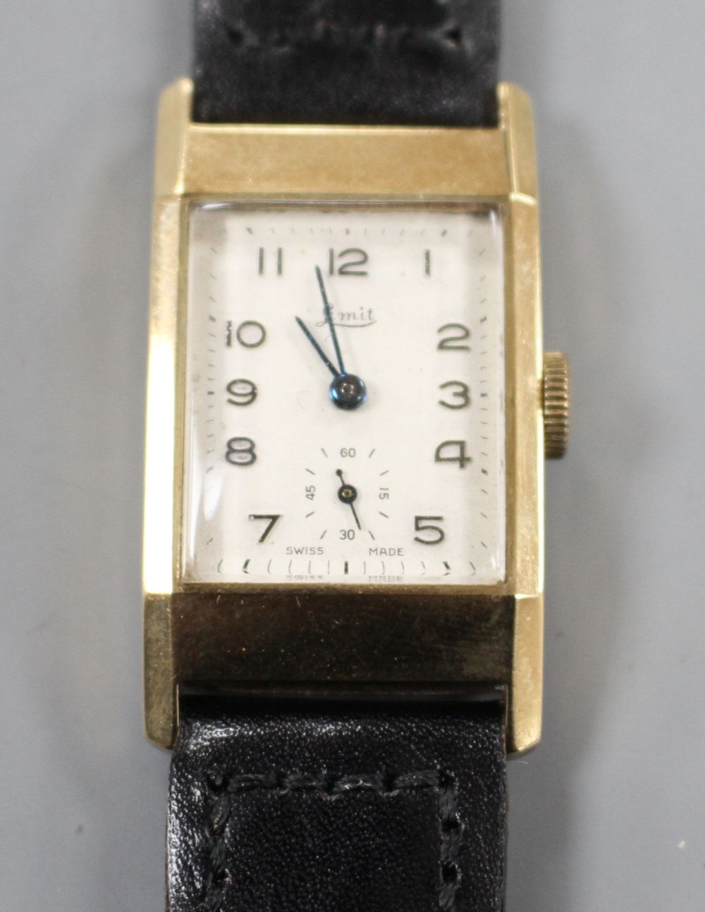 A gentlemans late 1950s 9ct gold Limit manual wind wrist watch, with rectangular Arabic dial and subsidiary seconds,